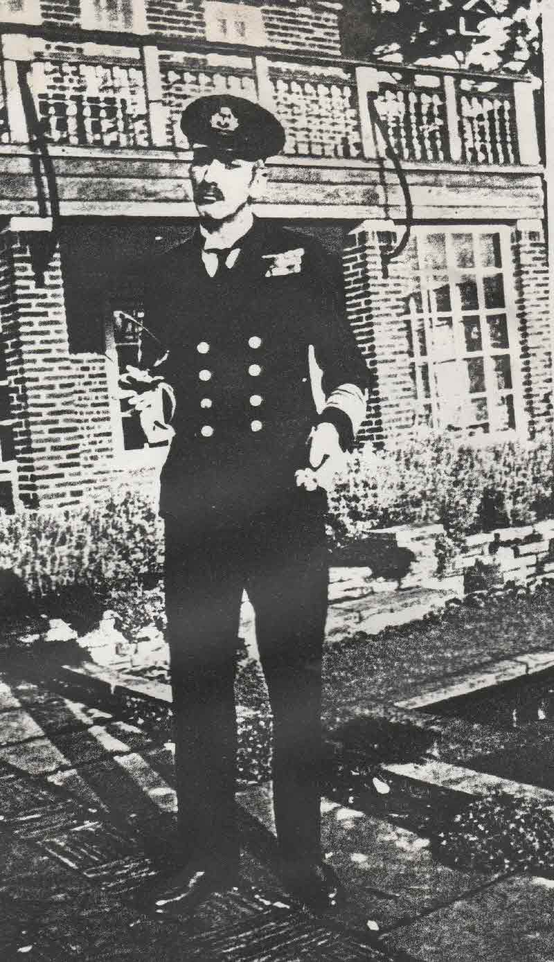 Dr Bell Nicoll dressed as the King of Norway outside the Dower House